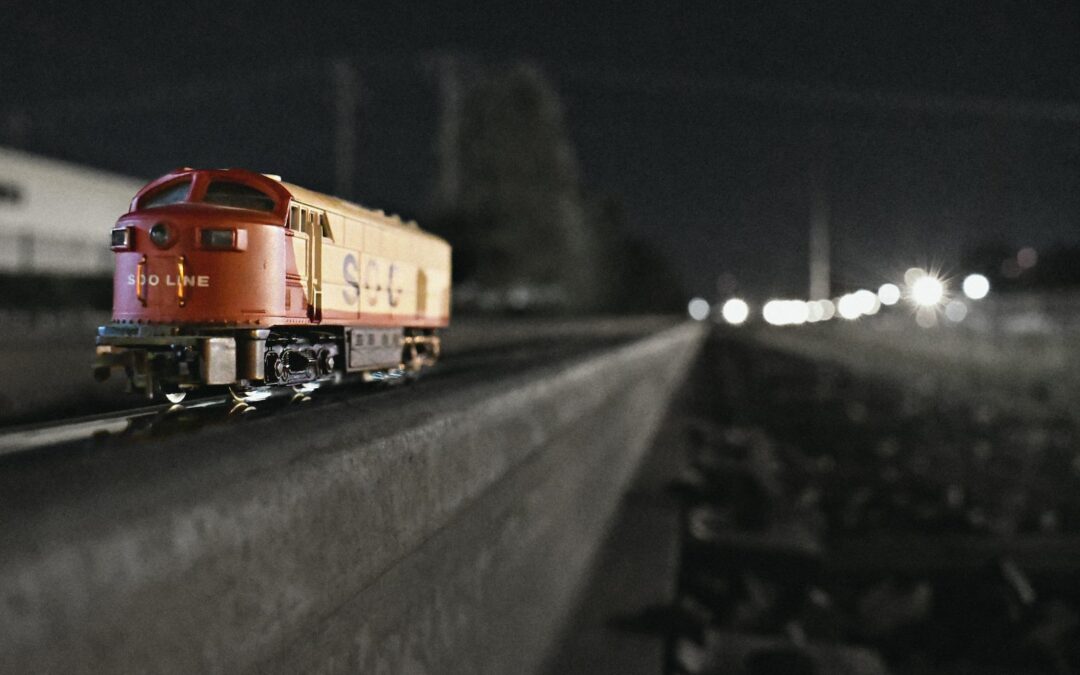 shallow focus photography of red and yellow train toy