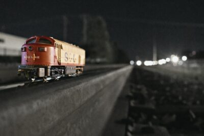 shallow focus photography of red and yellow train toy